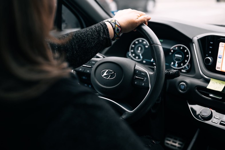 WOMAN SITTING INSIDE A CAR HYUNDAI