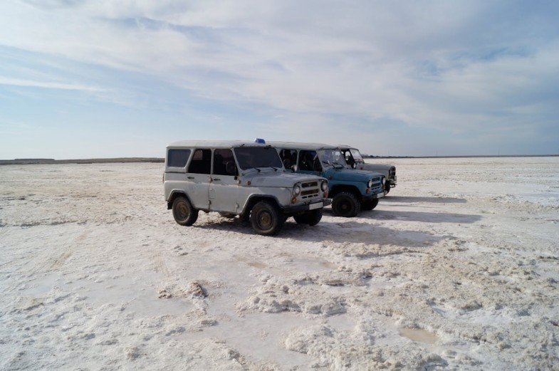 TRUCKS ON THE DESERT SAND