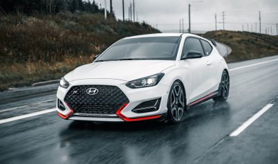 PHOTO OF WHITE CAR ON WET ROAD HYUNDAI