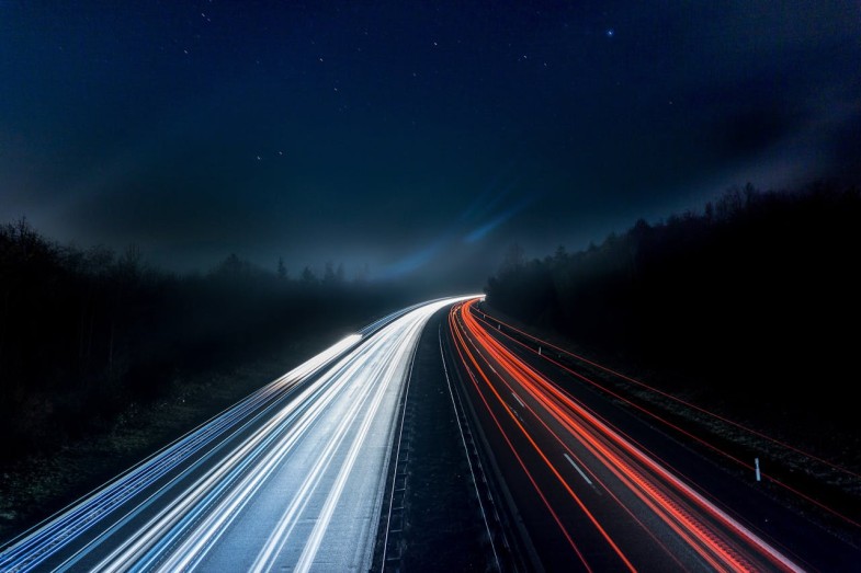 LIGHT TRAILS FROM CARS DRIVING ON THE ROAD