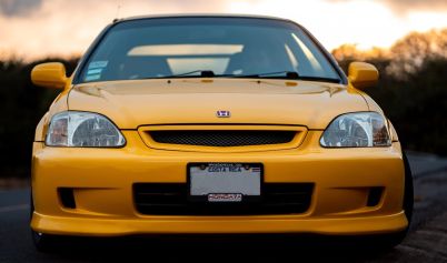 YELLOW HONDA CAR DURING SUNSET