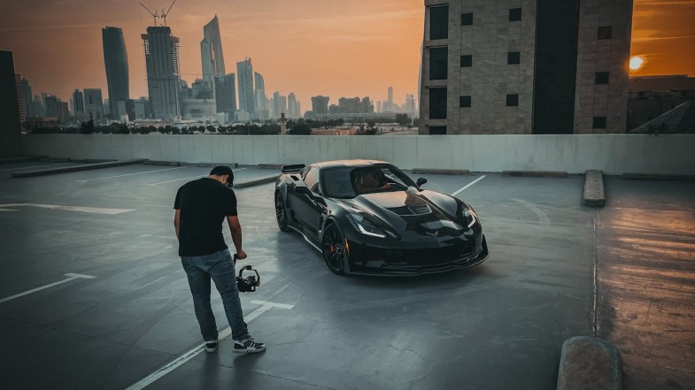 MAN FILMING CHEVROLET CORVETTE