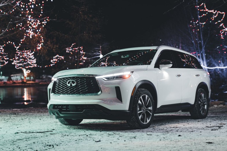 INFINITI Q60 AMONG CHRISTMAS LIGHT AT NIGHT