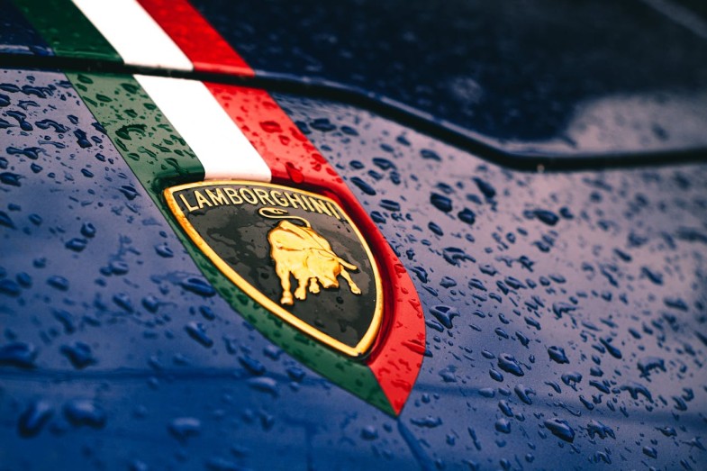 PHOTO OF LAMBORGHINI LOGO IN FRONT OF A CAR