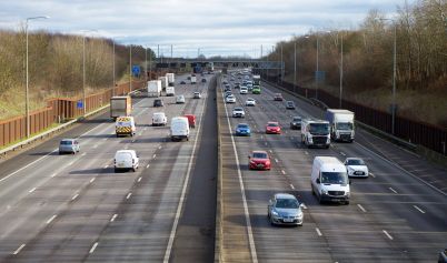 AERIAL VIEW OF CARS ON A HIGHWAY