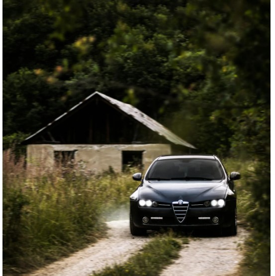 BLACK ALFA ROMEO 159 ON DIRT ROAD
