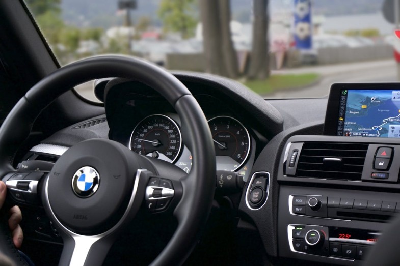 PERSON DRIVING BMW CAR