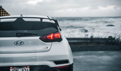 PHOTO OF A WHITE HATCHBACK CAR HYUNDAI
