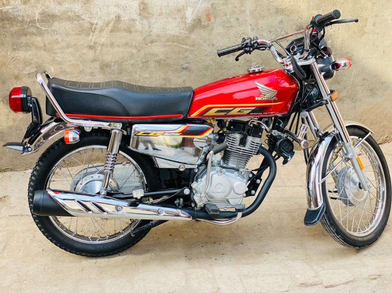 A BRAND NEW BLACK AND RED HONDA MOTORYCYLE