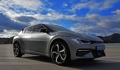 PHOTO OF A CAR UNDER A CLOUDY SKY KIA