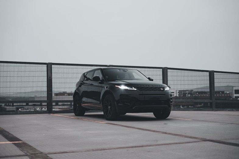 LAND ROVER PARKED ON ROOFTOP PARKING LOT
