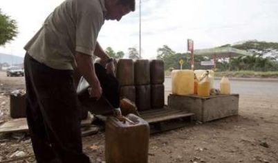 IEA sees 2015 oil demand growth much lower, supply hitting prices