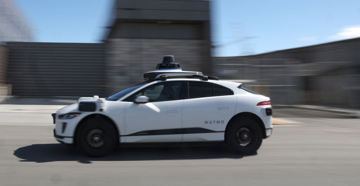 Waymo robotaxi driving on city street