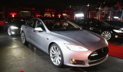 Tesla third-quarter loss doubles to $75 million, shares jump