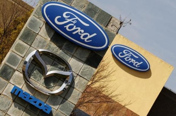 Ford shares tumble on lower profit outlook for 2014-2015