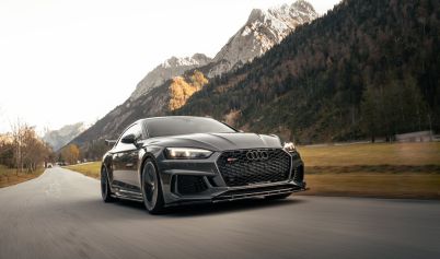 Black Audi on Road Near Mountain