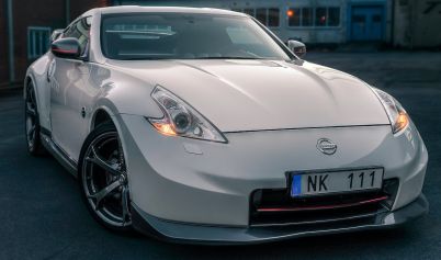 WHITE NISSAN CAR