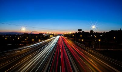 LIGHT TRAILS FROM CARS DRIVING ON THE ROAD