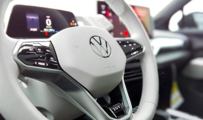 A WHITE VOLKSWAGEN STEERING WHEEL