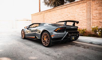 GRAY LAMBORGHINI PARKED ON THE ROAD