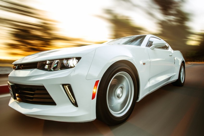 CLOSE UP PHOTOGRAPHY OF WHITE CHEVROLET CAMARO