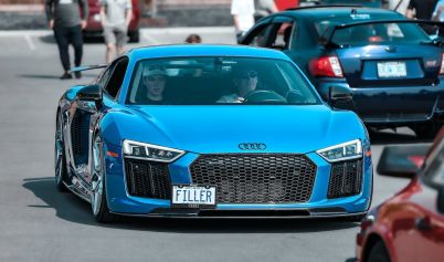 MAN DRIVING BLUE AUDI R8 ON  STREET