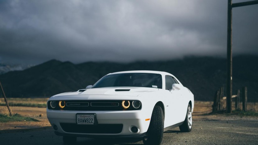 WHITE DODGE CHARGER ON THE ROAD
