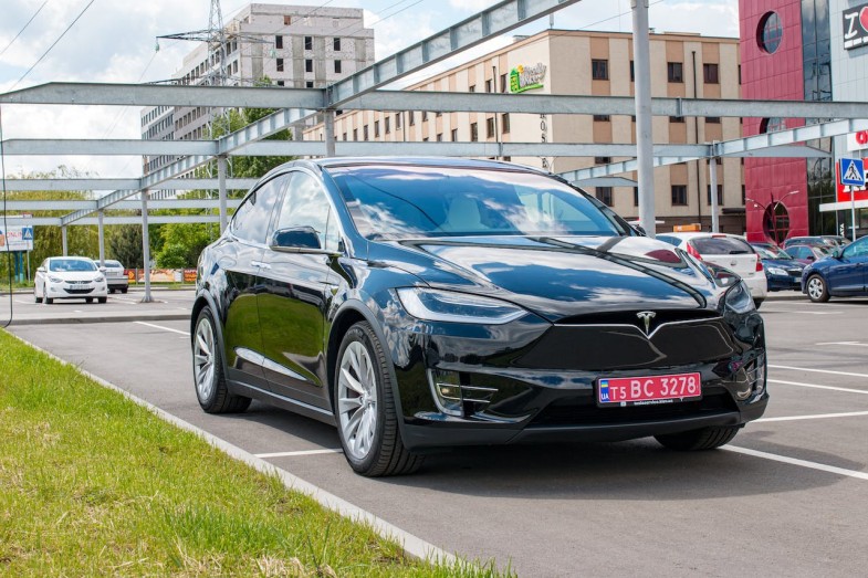 TESLA PARKED BLACK VEHICLE