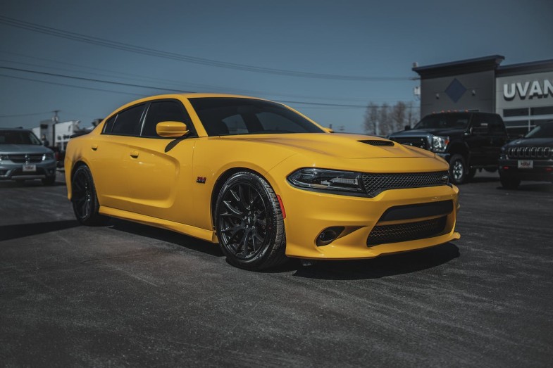 A PARKED YELLOW DODGE CHARGER