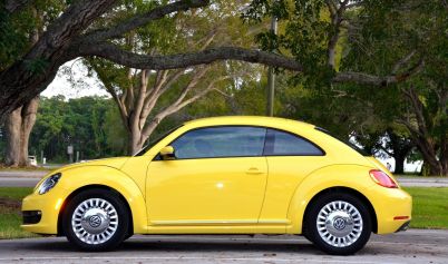 VOLKSWAGEN YELLOW CAR PARK TREES GREEN