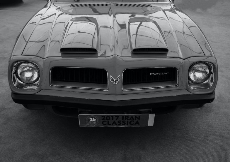 GRAYSCALE PHOTO OF A CLASSIC CAR PONTIAC