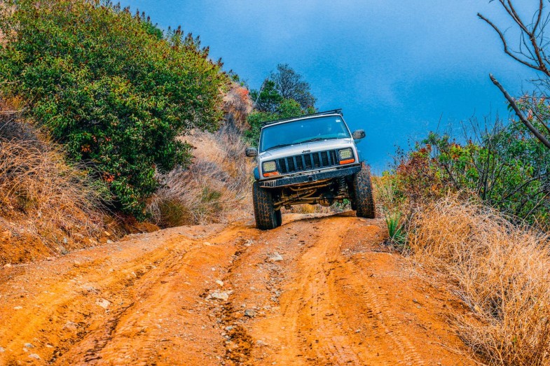 WHITE TRUCK ON BROWN ROAD, JEEP CAR BRAND