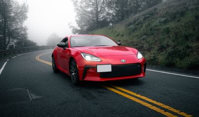 A Red Toyota GR86 on an Asphalt Road
